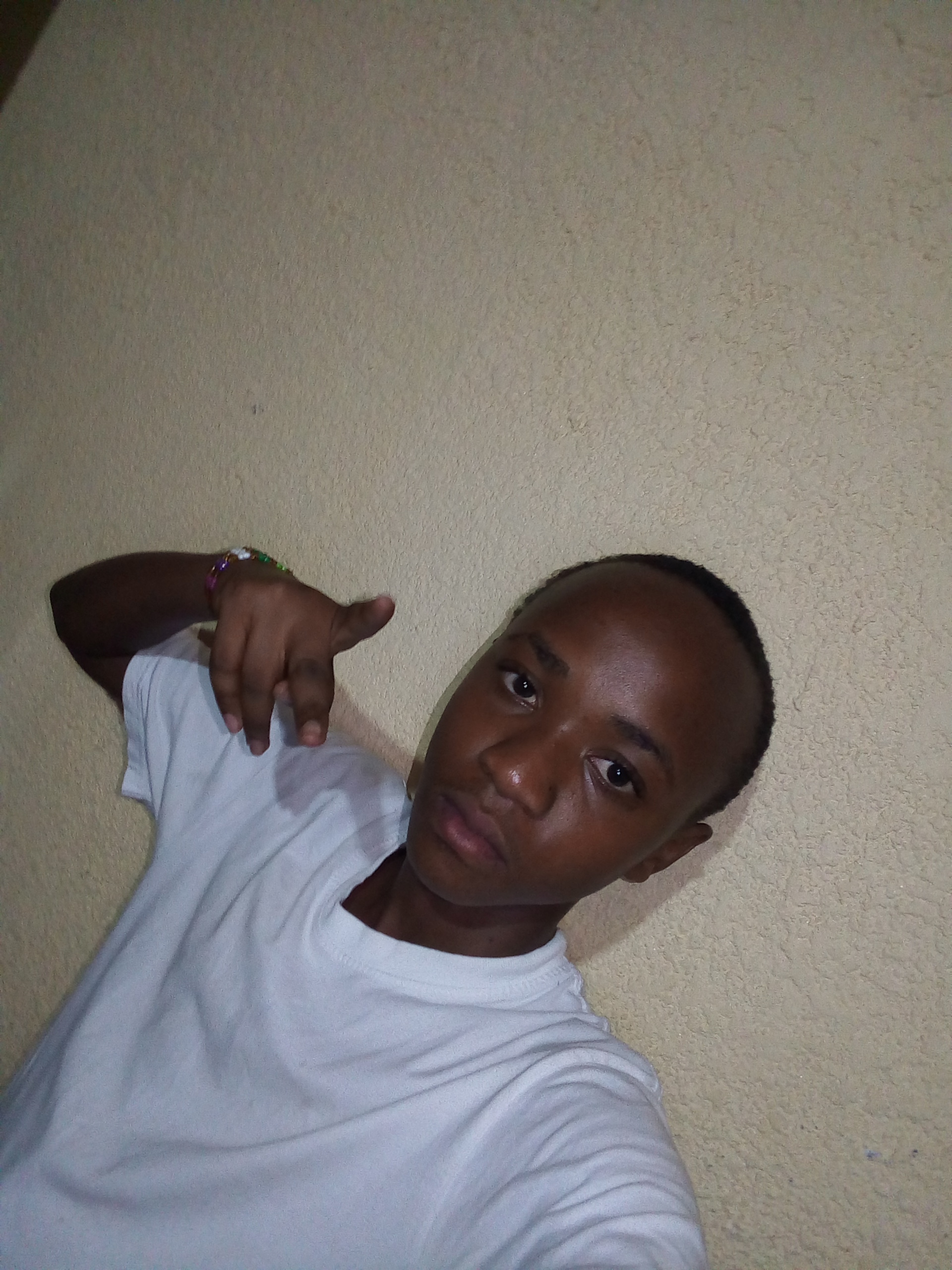 A man in a alice blue shirt with a thinking expression
